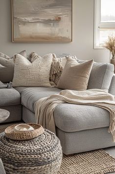 a living room filled with furniture and pillows