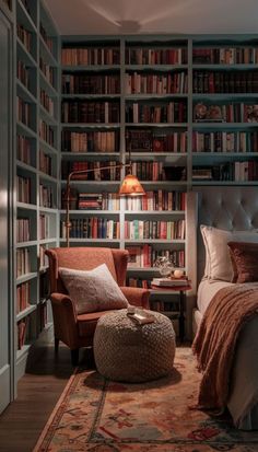 a bedroom with a bed, chair and bookshelf full of bookcases