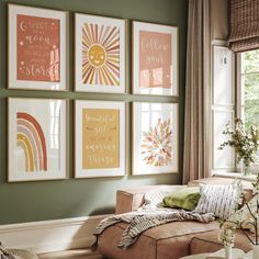 a living room filled with furniture and pictures on the wall above it's windows