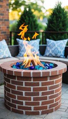 a fire pit sitting on top of a brick patio