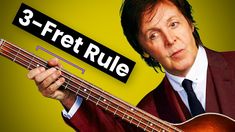 a man in a suit holding a guitar with the words 3 - fret rules