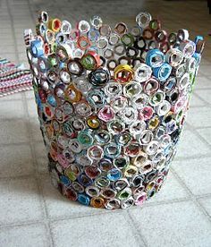 a trash can made out of magazines on the floor