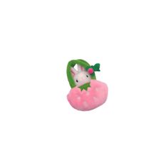 a pink and green stuffed animal with a bow on it's head in the shape of a strawberry