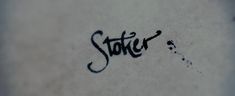 graffiti written on the side of a white wall that says, sticher?