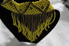 This gorgeous beaded necklaces are definitely statement pieces. Drawing attention to the neck with a bold beautiful color. This necklace was crafted in Kisumu, Kenya with love.  Free shipping for orders over $35. *Bracelet not included* Yellow Round Beads Choker For Festivals, Yellow Beaded Choker Necklace For Festivals, Yellow Choker With Round Beads For Festivals, Yellow Festival Choker With Round Beads, Costume Jewelry Beaded Choker Necklace, Large Round Beads Choker, Bohemian Faceted Beads Choker, Yellow Beaded Choker Jewelry, Unique Round Beads Choker