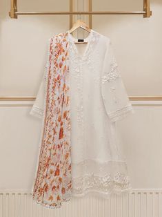 Agha Noor embroidered suit with floral dupatta Floral Embroidered Lawn Suit For Wedding, Elegant White Unstitched Suit For Spring, Spring Wedding Lawn Suit With Intricate Embroidery, Long Sleeve Anarkali Set With Intricate Embroidery For Spring, Spring Anarkali Set With Intricate Embroidery And Long Sleeves, Elegant Summer Unstitched Suit With Floral Embroidery, Elegant Floral Embroidered Cambric Sets, White Chanderi Sets For Eid, White Anarkali Lawn Suit For Festive Occasions