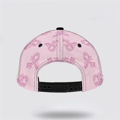 a pink baseball cap with butterflies on it