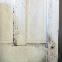 an old door with peeling paint on it