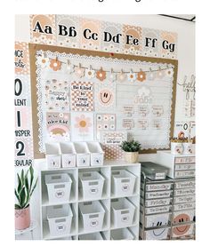 an organized craft room with lots of storage boxes and bins on the wall next to it