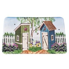 a door mat with two little houses painted on the front and side of it,