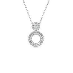 A diamond necklace that looks right with everything. This piece features a figure-8 pendant shining and shimmering in style. The pendant's top small circle is completely dressed with a cluster of diamonds while the bottom bigger circle has a concentric design with an inner ring of diamonds and an outer beaded ring in yellow gold. Dazzling Silver Diamond Necklace With Halo, Silver Diamond Necklace With Halo, Diamond White Pendant Necklace With Halo Design, Dazzling Silver Diamond Halo Necklace, Diamond White Necklace With Halo Pendant, Dazzling Round Pendant Diamond Necklace With Halo Design, Diamond White Round Pendant Necklace With Halo, Diamond White Pendant Necklace With Halo, Dazzling Diamond Necklace With Halo Design And Round Pendant