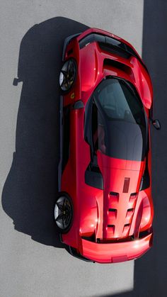 an overhead view of a red sports car