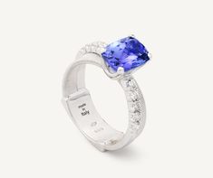 In this elegant 18K white gold ring, a carefully selected 2.33 ct cushion-cut tanzanite is nestled on flat coil thread, finely handcrafted with the brand�’s exclusive coil technique, and surrounded with an elegant brilliant-cut diamond band. The result is a refined and timeless ring perfect for a heartfelt gift. Double Band Rings, Timeless Ring, Bangles Style, White Gold Ring, Diamond Band, Heartfelt Gifts, High Jewelry, Cushion Cut, Birthstone Jewelry