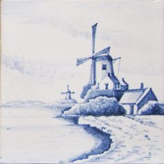 a blue and white tile with a windmill in the background