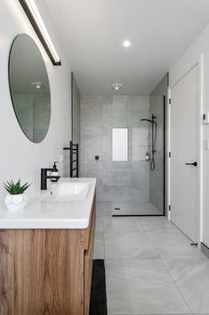 Bathroom Bathroom White Black Wood, Grey And White Tiled Bathroom, Grey Marble And Wood Bathroom, Gray White Wood Bathroom, Grey White Timber Bathroom, Black White Grey Timber Interior, White And Grey Tiles Bathroom, Grey White Tile Bathroom, Grey White Wood Interior