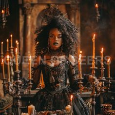 a woman dressed in an elaborate black dress surrounded by candles