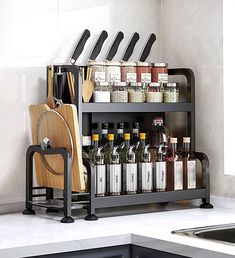 a kitchen counter with knives and spices on it