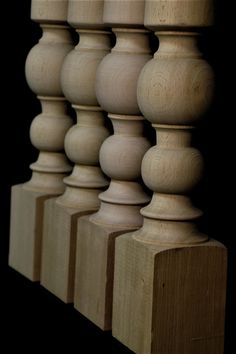 a row of wooden balconies sitting next to each other on a black background