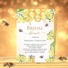 the bridal shower is decorated with yellow flowers and bees