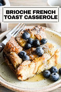 a plate topped with blueberries and french toast casserole