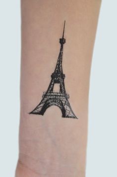 the eiffel tower tattoo on the wrist