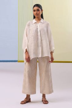 Off white shirt with placed thread embroidered floral motifs. Comes with geometric embroidered pattern pant. - Aza Fashions White Summer Sets With Set-in Sleeves, Elegant White Pant Set With Resham Embroidery, Chic White Embroidered Set, Elegant Pant Set With Intricate Embroidery For Spring, Chic White Festive Sets, Chic Festive White Sets, Elegant Spring Pant Set With Intricate Embroidery, Elegant White Festive Pants, Elegant White Embroidered Pant Set