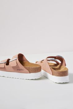 These iconic two-strap sandals get a fresh update with an EVA platform sole and a soft pink leather upper. At the heart of every Birkenstock design is the legendary footbed. The details are all in the design; each element of the footbed serves a purpose to encourage proper foot health. The result is signature style coupled with all-day comfort. | PAPILLIO BY BIRKENSTOCK Women's Arizona Platform Sandals, Size 38, Pink Trendy Leather Footbed Sandals With Cork-bed Midsoles, Pink Leather Sandals With Cushioned Footbed, Pink Leather Footbed Sandals For Spring, Pink Leather Sandals With Textured Footbed, Pink Leather Sandals With Leather Footbed, Pink Double Strap Slides For Spring, Pink Footbed Sandals With Removable Insole And Round Toe, Pink Leather Footbed Sandals With Removable Insole, Pink Leather Footbed Sandals With Textured Footbed