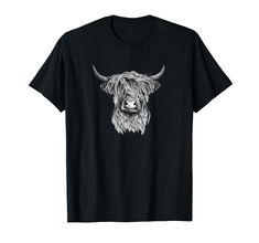 a black t - shirt with an image of a cow's head