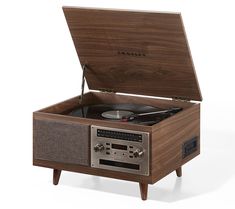 the record player is made from wood and has an old - fashioned record player in it