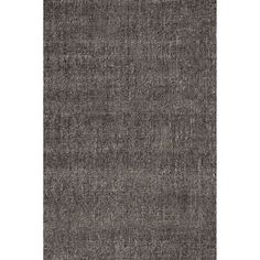 an area rug with dark grey tones