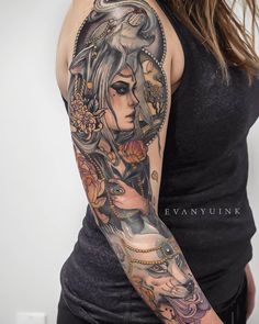 a woman's arm with tattoos on it