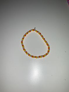 This is a sunset bracelet that will truly make you shine within the bracelet you have 3 different colours that are orange yellow and white Orange Round Beads Jewelry For Everyday, Everyday Orange Round Bead Jewelry, Yellow Round Bead Bracelets For Everyday, Yellow Beaded Bracelets For Everyday, Yellow Round Beads Bracelet For Everyday, Orange Handmade Friendship Bracelets, Trendy Yellow Friendship Bracelets With Colorful Beads, Handmade Orange Friendship Bracelets For Everyday, Everyday Colorful Beads Orange Jewelry