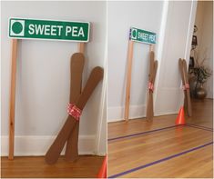 there are two wooden sticks that have been placed on the floor and one is made out of cardboard