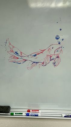 a drawing of a koi fish in red, white and blue ink on paper