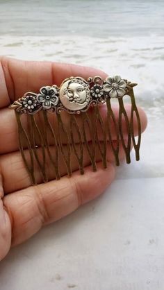 Moon Haircomb This Crescent Moon face Hair Comb makes a lovely hair accessory for beautiful hair styles. This haircomb is charming with elegant and amazing Flowers. It is great for special occasions like weddings, but can also be great for everyday wear ☻Link to More Hair Accessories: https://www.etsy.com/shop/FashionCrashJewelry?ref=profile_header&search_query=hair+accessories ☻Link to The ENTIRE SHOP: https://www.etsy.com/shop/FashionCrashJewelry?ref=shopsection_shophome_leftnav&ga_search_quer Flower Hairpiece, Celestial Gifts, Pin Man, Man In The Moon, Yokai Watch, In The Moon, Dope Jewelry