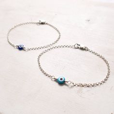 "Dainty Evil Eye Bracelet in Sterling Silver A minimalist take on traditional evil eye protection bracelet. Dainty and lightweight, easy to wear every day. Great on its own or for layering with other bracelets. It will make a wonderful gift for sister, friend, girlfriend. You can pair the cobalt blue bracelet with a matching necklace: https://www.etsy.com/listing/607878204/ MEANING: The evil eye is a curse believed to be cast by a malevolent glare. Many cultures believe that receiving the evil e Minimalist Blue Evil Eye Bracelet For Everyday, Blue Adjustable Dainty Evil Eye Bracelet, Silver Metal Evil Eye Bracelet As Gift, Minimalist Blue Bracelet With Adjustable Chain, Adjustable Silver Evil Eye Bracelet, Blue Evil Eye Bracelet With Adjustable Length, Bracelets Evil Eye, Nazar Bracelet, Adjustable Blue Evil Eye Bracelet, Nickel Free