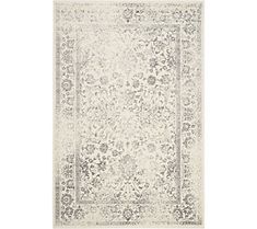 a white rug with an ornate design on the top and bottom, in grey tones