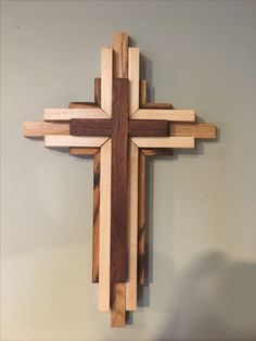 a wooden cross hanging on the wall