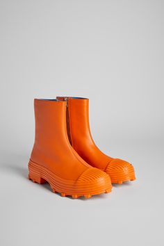 Vulcanized orange leather zip boots with toothed rubber outsoles and OrthoLite® cushioned footbeds. Orange Waterproof Boots With Round Toe, Colorful Boots, Interesting Shoes, Orange Boots, Camper Shoes, Funky Shoes, Orange Shoes, Shoes Heels Wedges, Spring Summer Collection