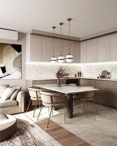 a kitchen and living room are shown in this modern style home with marble countertops