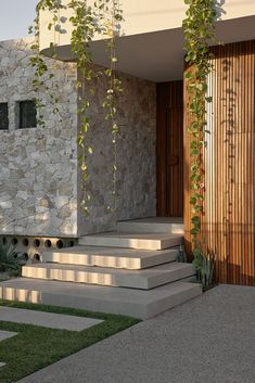 a house with stone steps leading up to the front door