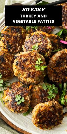 a plate full of meat patties and garnished with parsley