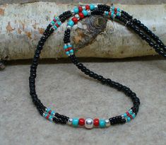 Southwest Turquoise Black Silver Choker Necklace. Turquoise, Black Red Beads Strung with a Silver Bead Centered in the front. Strung on Nylon Coated Wire for Durability. 21 inch and 18inch length. Adjustable Black Beaded Turquoise Necklace, Southwestern Black Necklace With Colorful Beads, Southwestern Black Beaded Necklace Gift, Southwestern Black Beaded Necklaces For Gifts, Southwestern Style Black Beaded Necklaces As Gift, Southwestern Style Black Beaded Necklaces For Gifts, Southwestern Style Black Beaded Necklace For Gift, Jean Jewelry, Silver Choker Necklace