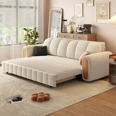 a living room scene with focus on the couch and rugs in the foreground