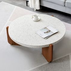 a coffee table with a magazine on it