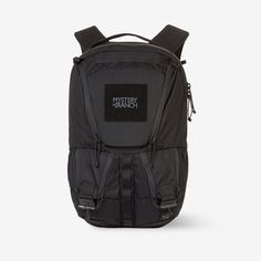 a black backpack that is on top of a white surface and has the word's logo