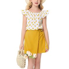 Make summer days a breeze with our adorable Kids Girls Outfits, featuring a delightful 2-piece set that includes a ruffle sleeveless printed top and solid skirt shorts. Designed specifically for toddlers aged 3-4 years, this outfit combines comfort and style, making it perfect for everything from playdates to family outings. Crafted from a premium blend of 50% rayon and 50% polyester, this summer clothing set is soft, lightweight, and breathable, ensuring your little one stays cool and comfortab Cute Yellow Sets For Summer, Cute Yellow Summer Sets, Cute Yellow Summer Set, Cute Summer Day Out Sets, Playful Yellow Sets For Vacation, Cute Spring Sets For Day Out, Cute Sets For A Day Out In Spring, Yellow Sleeveless Sets For Summer, Yellow Sleeveless Summer Set