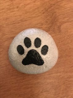 a rock with a paw painted on it