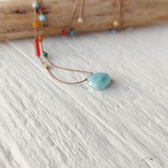 Dainty natrual larimar  necklace  with various gemstones randomly handknotted along the thread. Perfect eyecatching piece  to wear over summer outfits. To complement the center stone I chose:  Mediterranean coral, turquoise, larimar, yellow and white agate. You will wear a unique piece,  I'll make every one different but very similar.  If you prefer the prevalence of a color/stones please get in touch, when possible I'll be happy to customize it for you. Sterling silver spring clasp . Total leng Handmade Multicolor Amazonite Beaded Necklaces, Handmade Multicolor Amazonite Beaded Necklace, Larimar Gemstone Bead Necklaces For Gifts, Larimar Gemstone Beads Necklace As Gift, Larimar Gemstone Beads Necklace For Gift, Artisan Blue Amazonite Necklaces, Adjustable Turquoise Necklace As A Gift, Adjustable Light Blue Necklaces With Natural Stones, Adjustable Turquoise Necklace For Gift