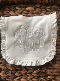 White Ruffle Baby Bib Monogrammed with baby's initials Shown in white on white with intertwine vine font Please note monogram in order of First LAST Middle Please note color of thread and font choice Washer safe/ hang dry or lay flat for best results drying From a smoke free shop Baby Monogram Ideas, Monogrammed Baby Clothes, Vine Font, Monogram Baby Girl, Monogram Baby, Diy Monogram, Personalized Baby Bibs, Monogram Outfit, Boy Bib